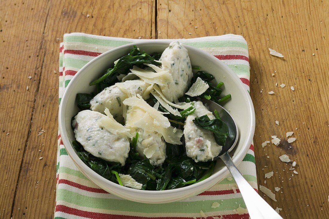 Ricotta and mortadella gnocchi with spinach and Parmesan
