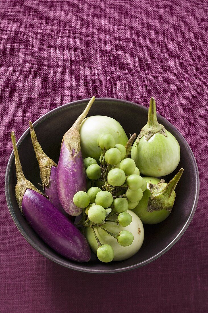 Various types of aubergines in bowl