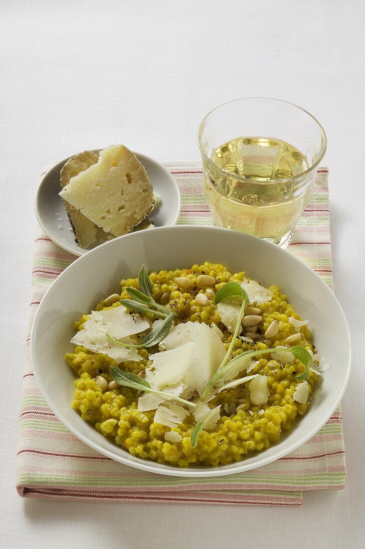 Risotto with sage, pine nuts & Parmesan, glass of white wine