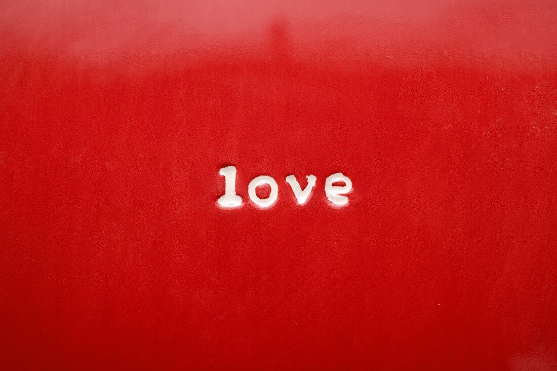 The word Love on red plate (close-up)