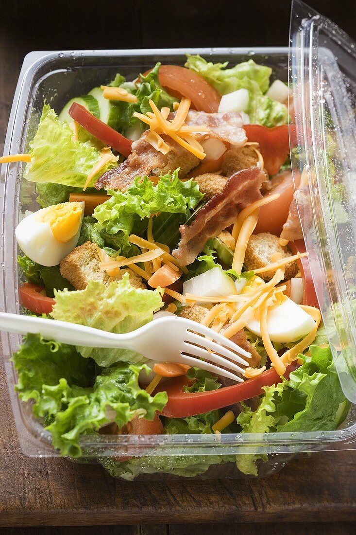 Salad leaves with vegetables, egg, cheese & bacon to take away