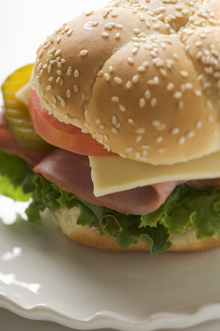 Ham, cheese, tomato and gherkin in sesame roll