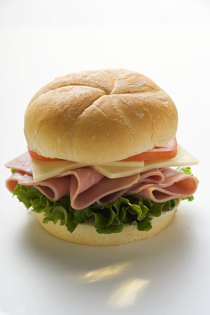 Ham, cheese and tomato in kaiser roll