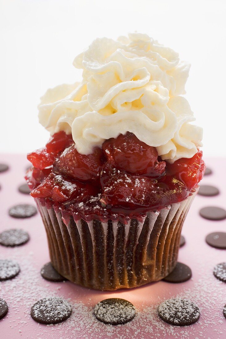 Chocolate cherry muffin with whipped cream