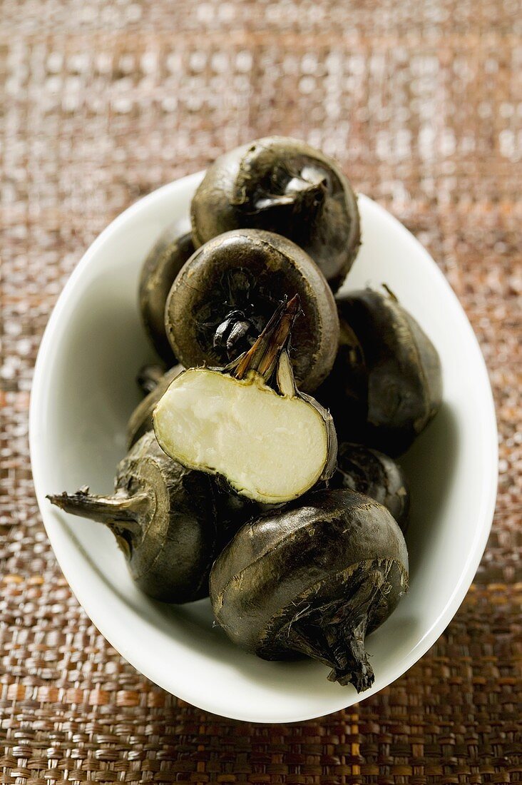 Fresh water chestnuts in white bowl