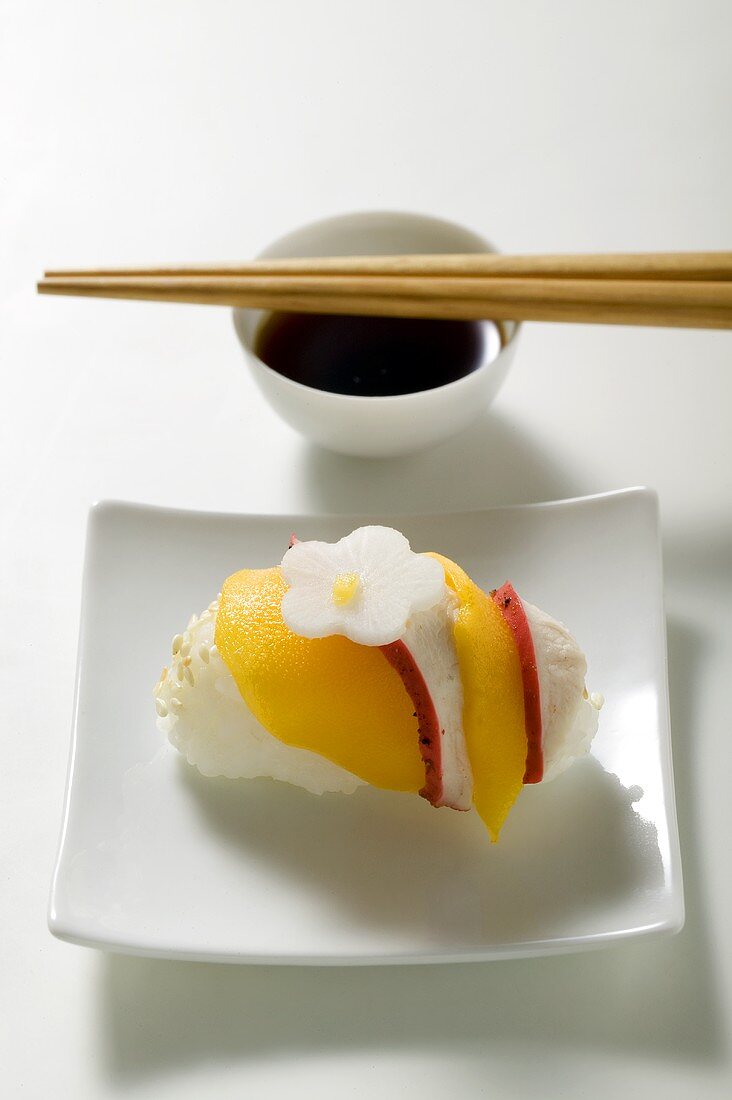 Nigiri sushi with chicken and mango