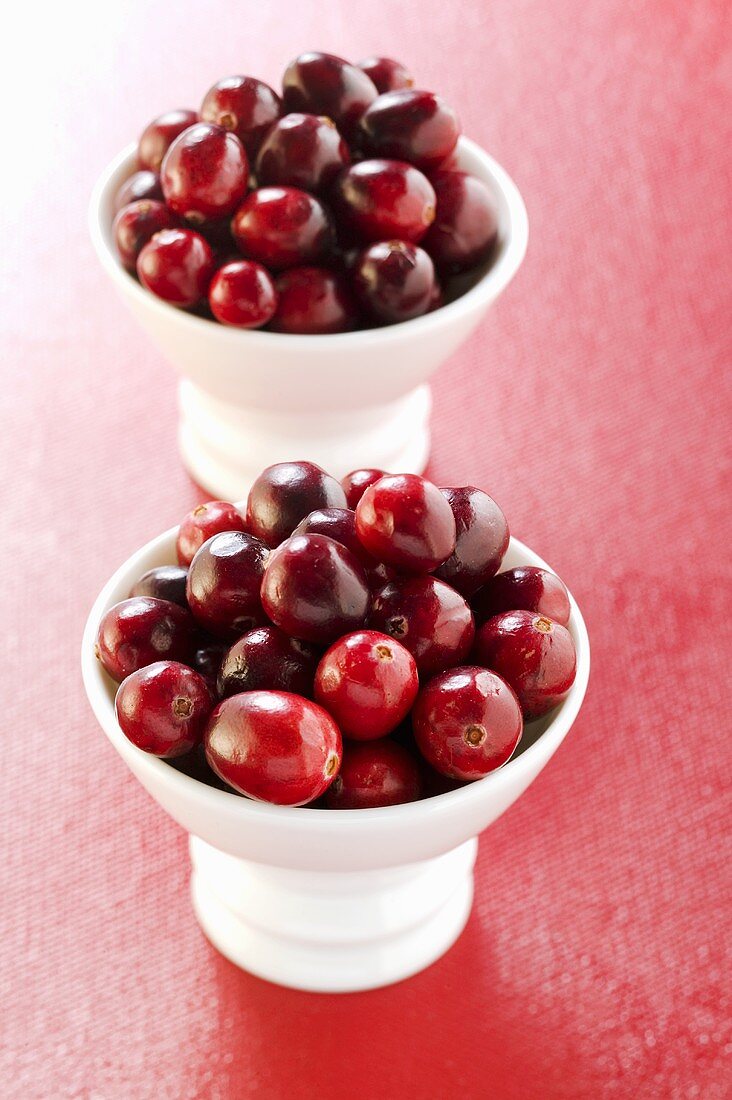 Cranberries in two small bowls