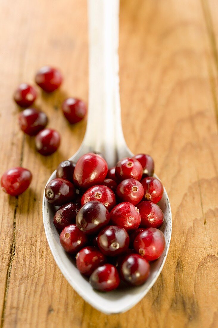 Cranberries on spoon