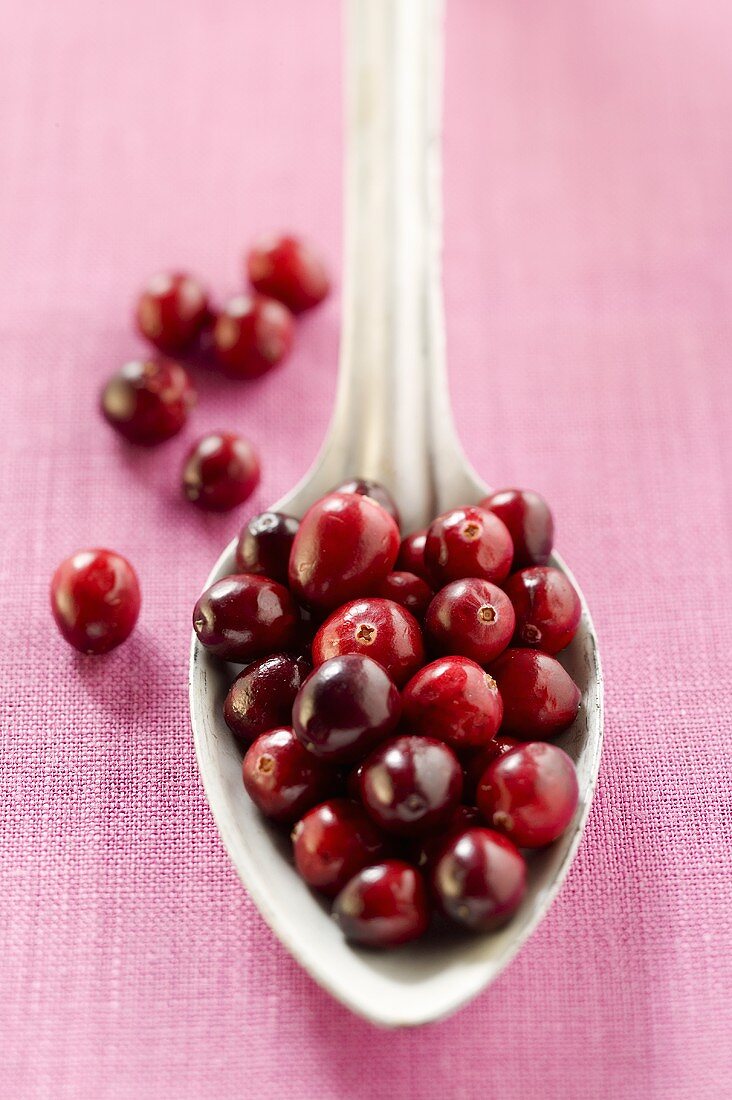 Cranberries on spoon