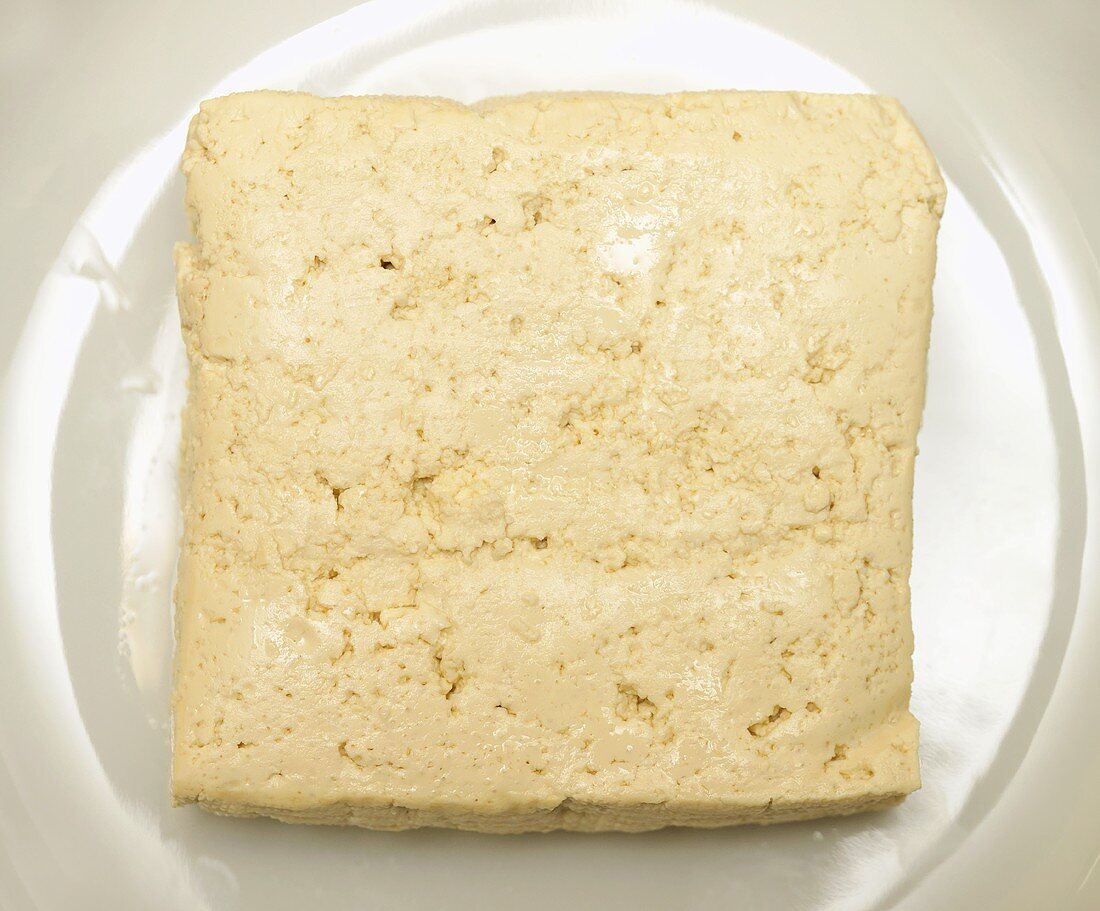 Slice of tofu on plate