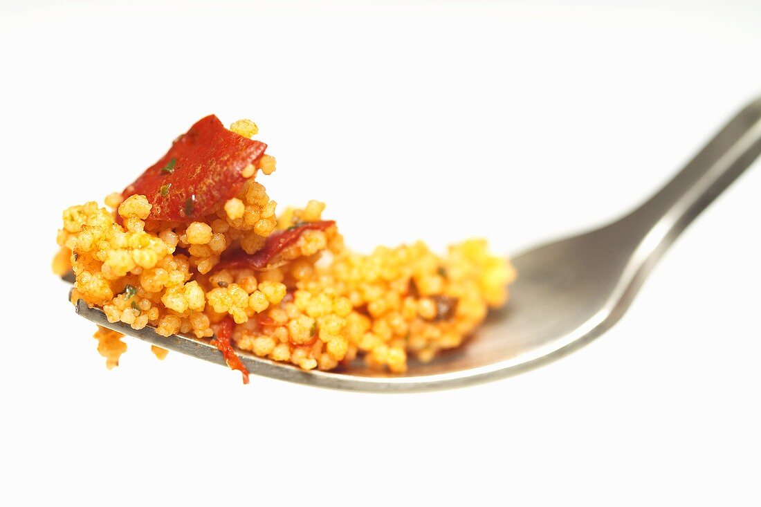 Bulgur wheat salad with peppers on fork