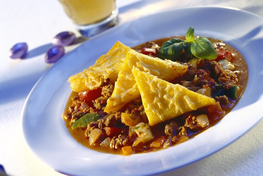 Mince ragout with baked polenta triangles