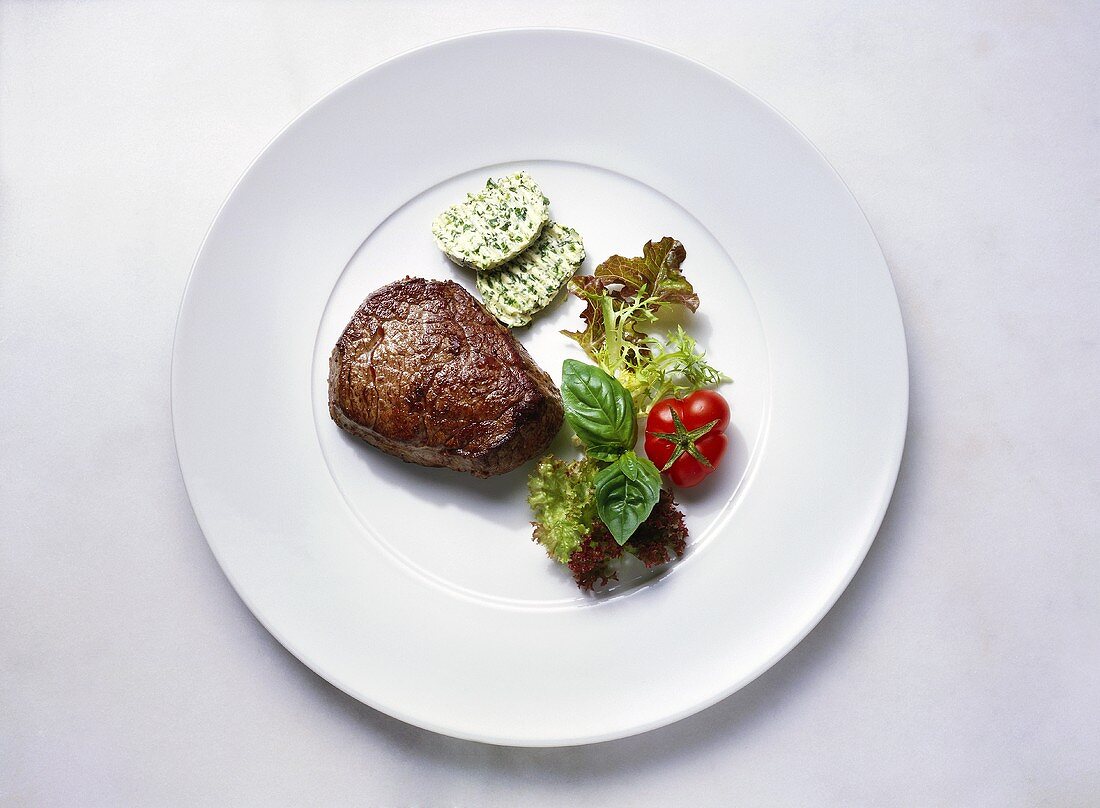 Fillet steak with herb butter and salad