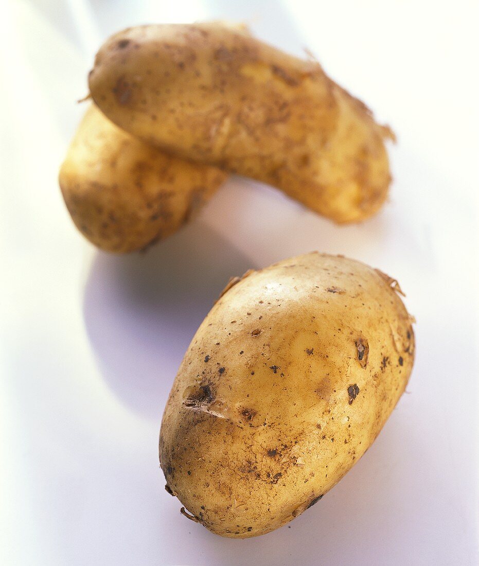 Three Italian Spunta potatoes