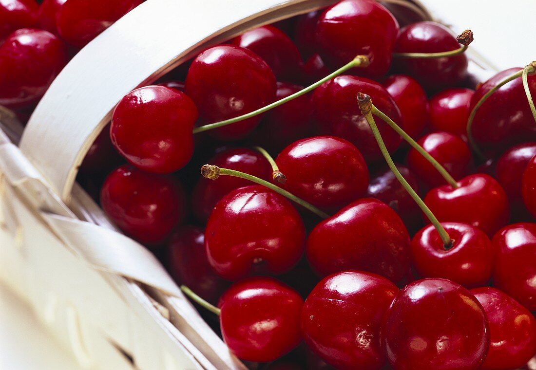 Red cherries in a chip basket, close-up