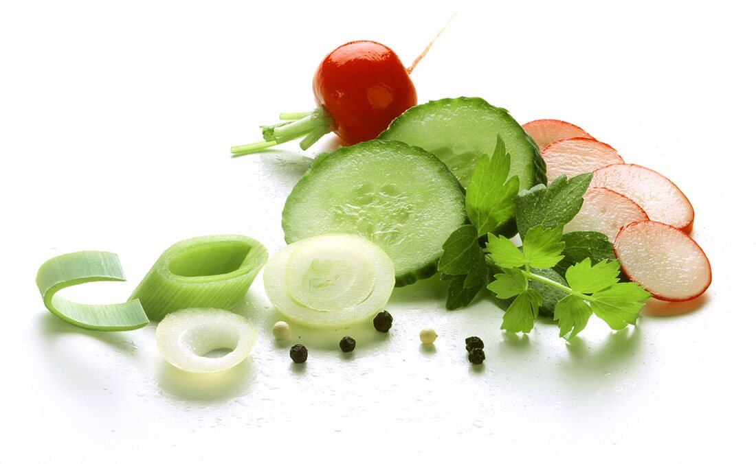 Salad ingredients: onion, leek, cucumber and radishes
