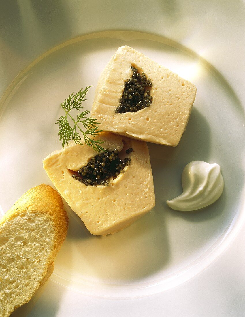 Sliced smoked Salmon Terrine with Caviar center and Bread slice
