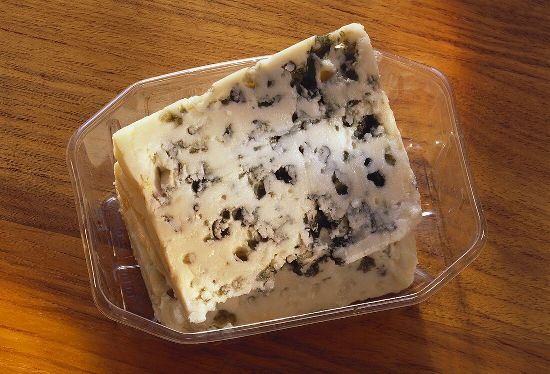 A Piece of Roquefort in a Plastic Bowl