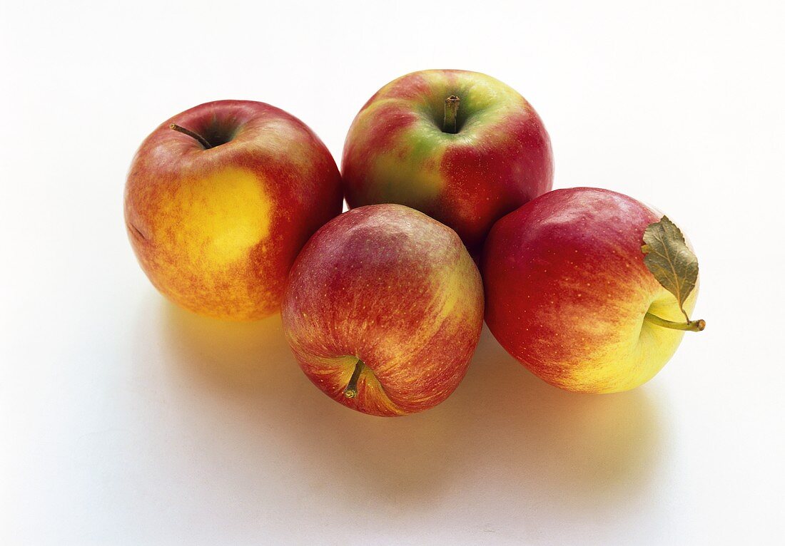 Several yellow and red apples