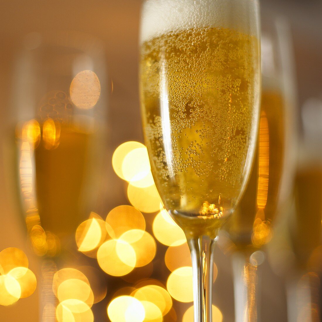 A glass of champagne in festive light
