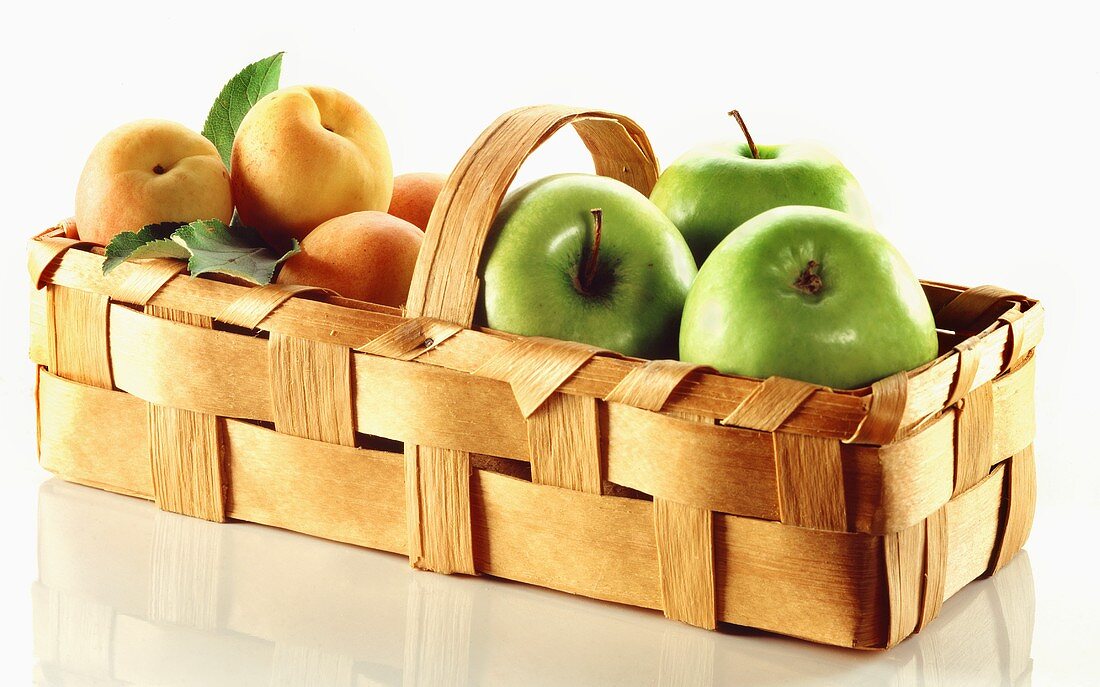 Apples and peaches in a basket
