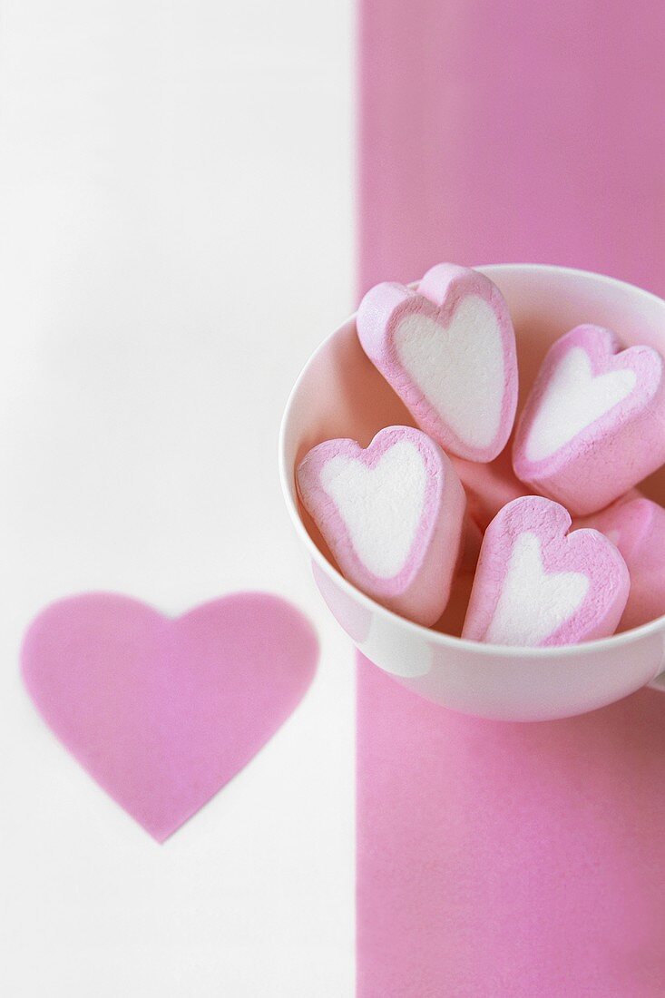 Several pink and white marshmallow hearts