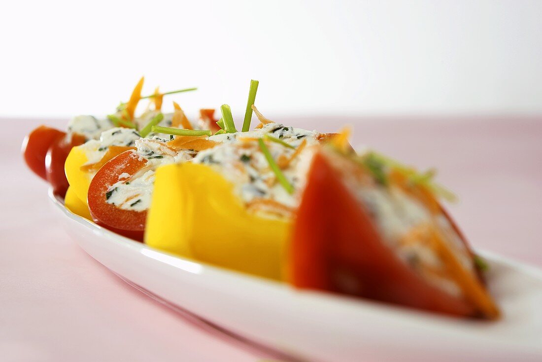 Peppers stuffed with soft cheese and vegetables