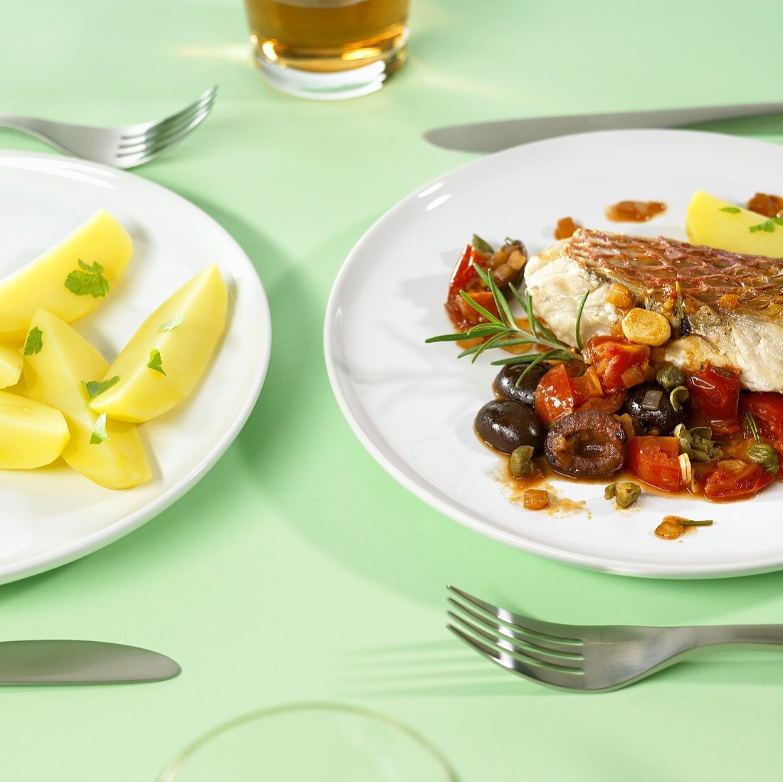 Fish fillet with mixed vegetables, capers and grapes