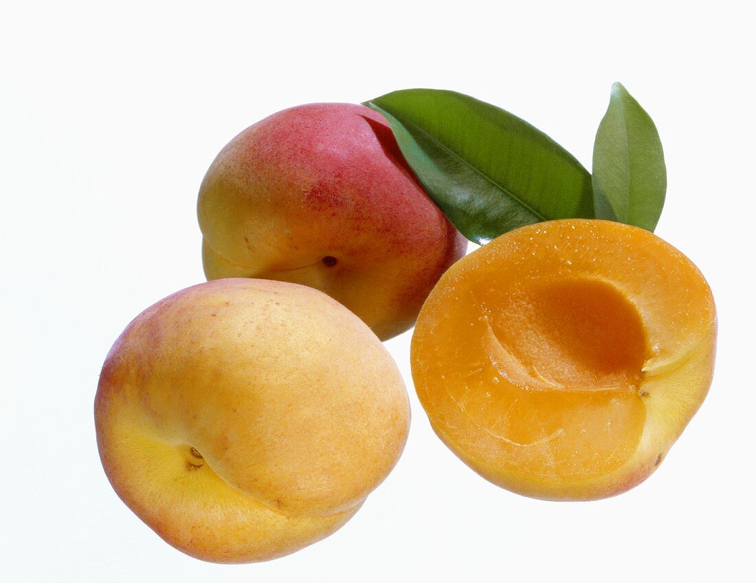 One half and two whole peaches