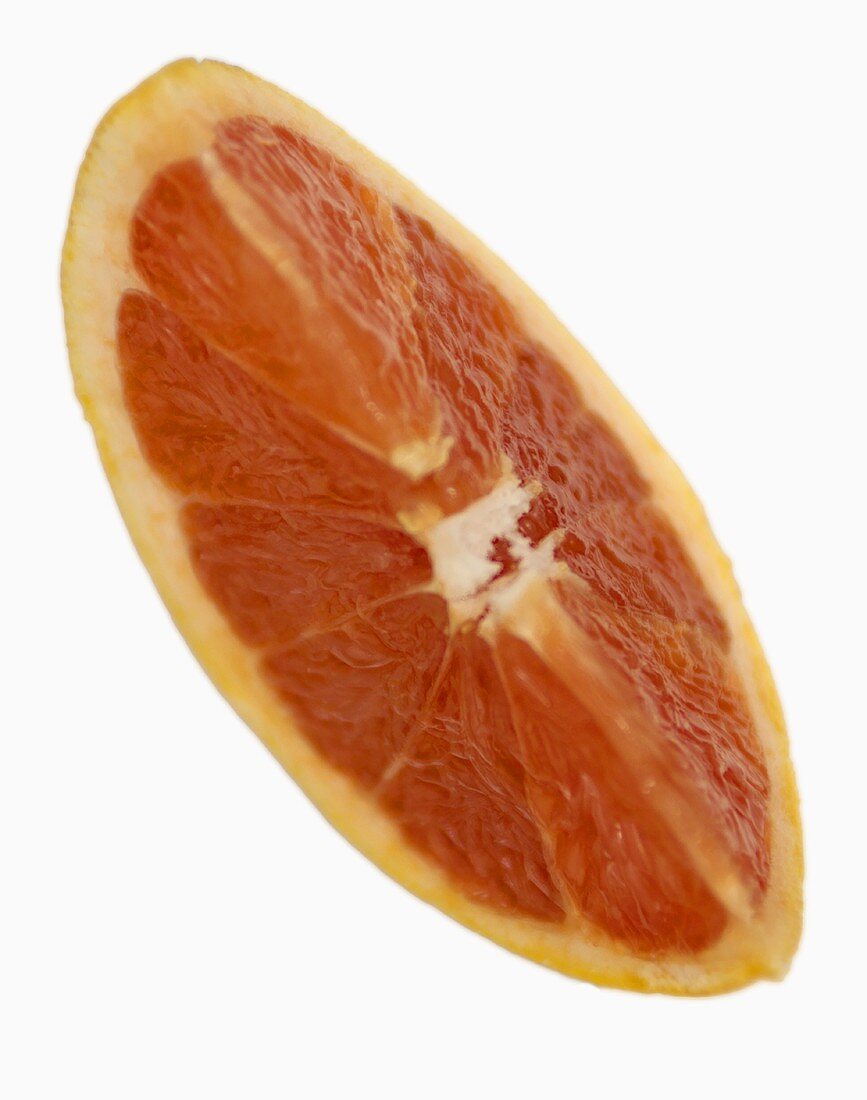 A wedge of red grapefruit