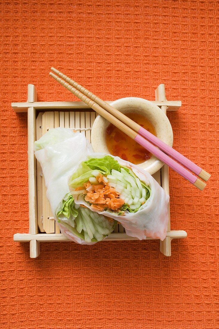 Vietnamese rice paper rolls with dip and chopsticks