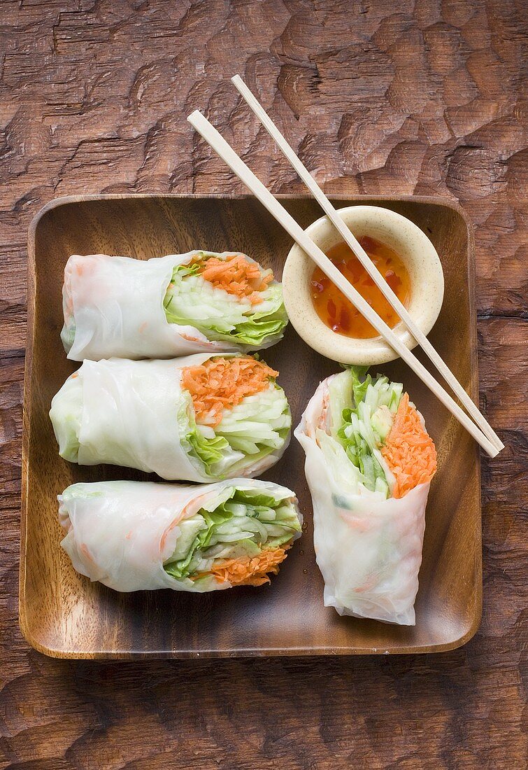 Vietnamese rice paper rolls with dip and chopsticks