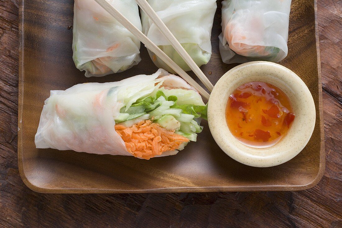 Vietnamese rice paper rolls with vegetables and spicy dip