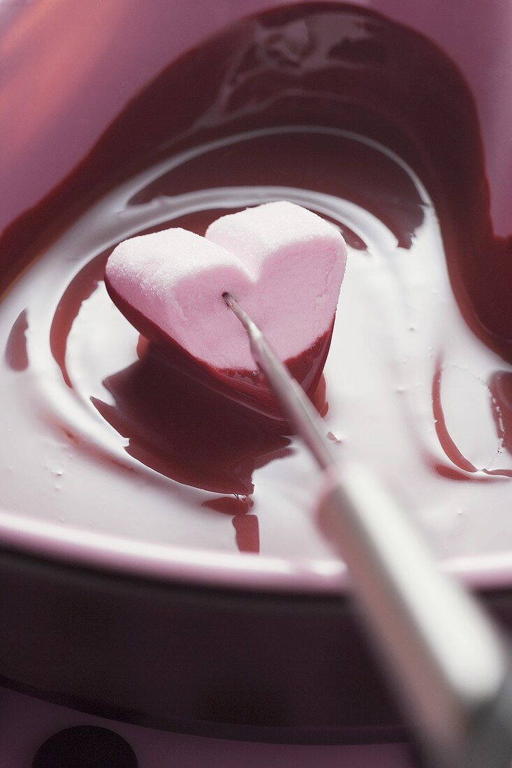 Chocolate fondue with heart-shaped marshmallow