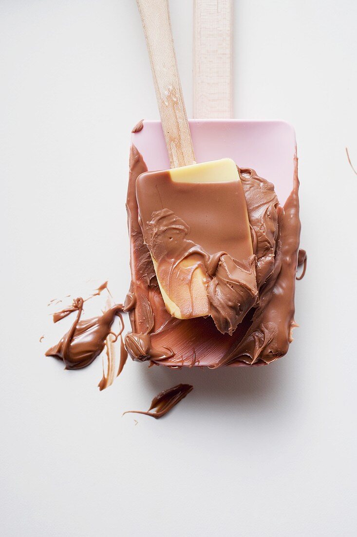 Mixing spoon with melted chocolate