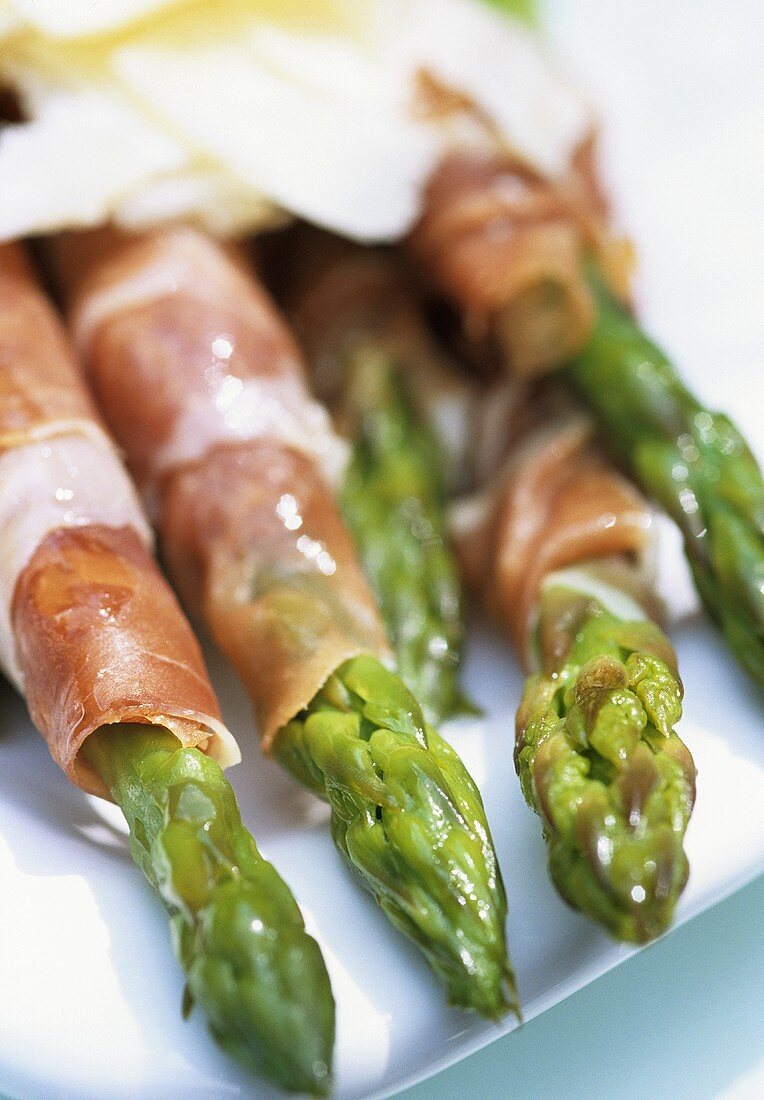 Green asparagus wrapped in ham