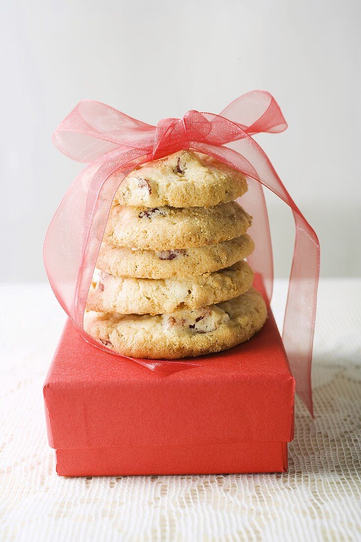 Biscuits tied with red bow on gift box