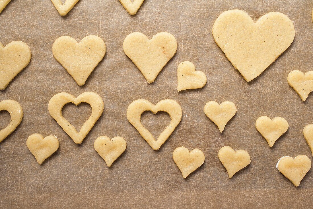 Cut-out biscuits on baking parchment