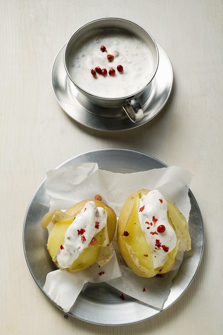 Potatoes cooked in their skins with sour cream & red pepper