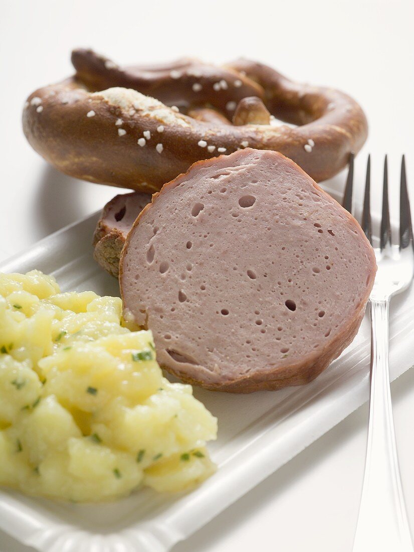 Warm Leberkäse (type of meatloaf) with potato salad & pretzel