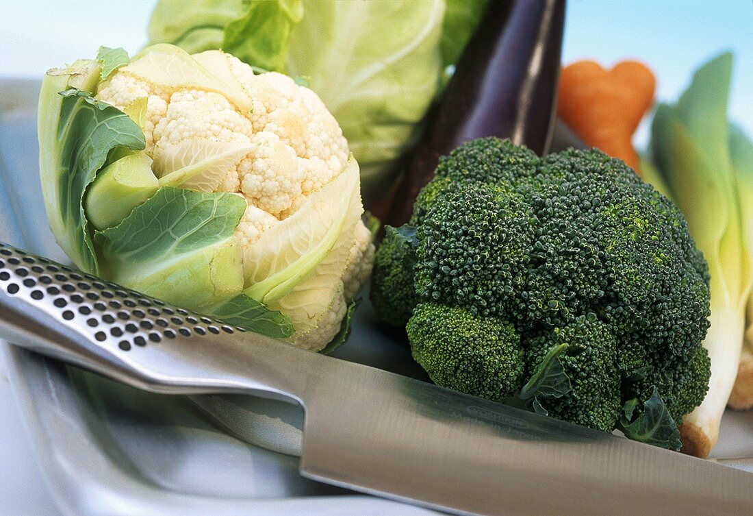 Cauliflower and broccoli with knife