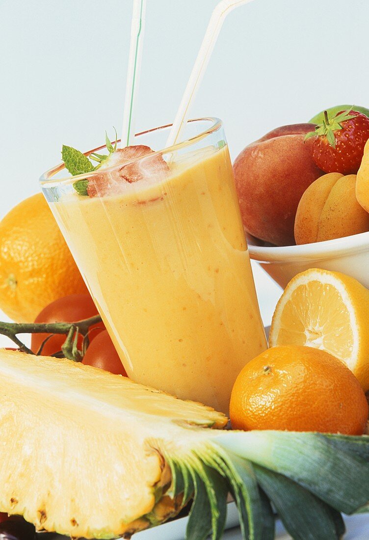Pineapple and orange juice with fresh fruit