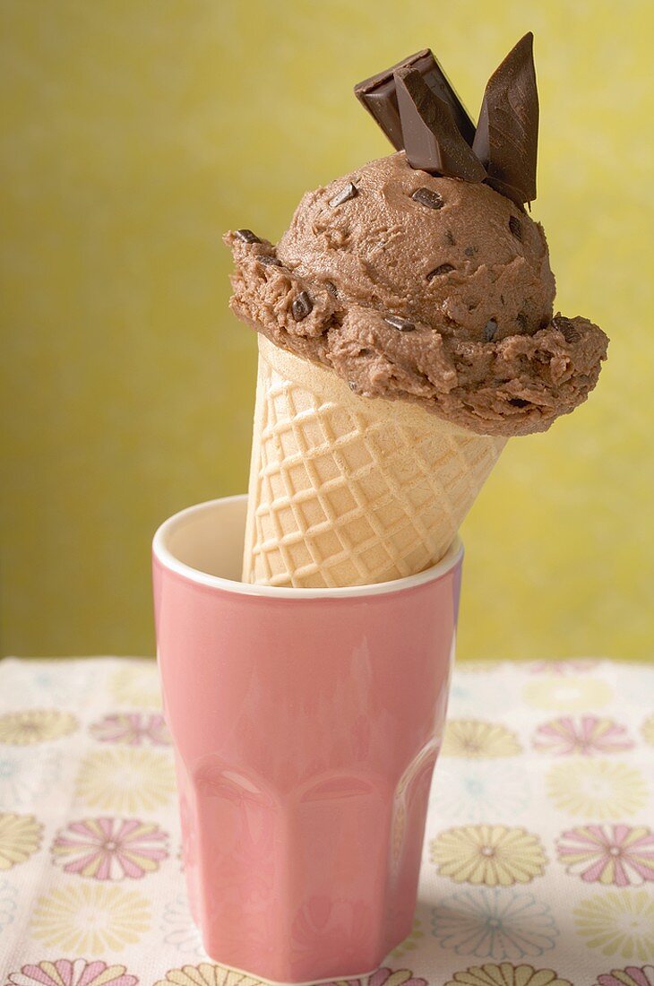 Chocolate ice cream cone in pink beaker