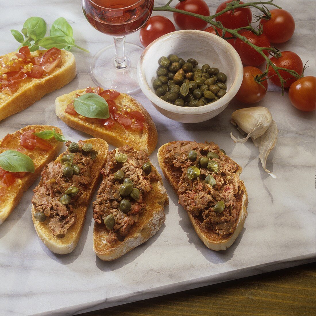 Bruschetta and crostini with paté and capers