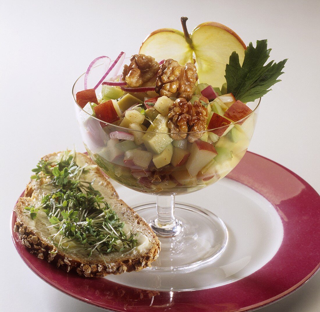 Spicy apple salad with walnuts, cress on bread & butter