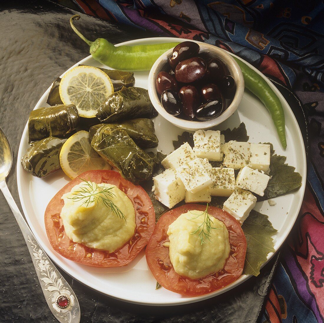 Appetiser plate with stuffed vine leaves, sheep's cheese etc.