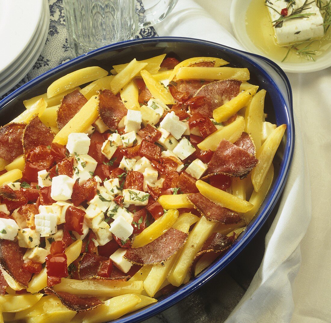 Potato, pepper, salami and sheep's cheese bake