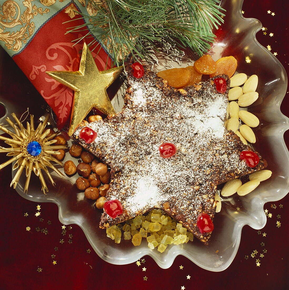 Star-shaped spice cake with Christmas decorations