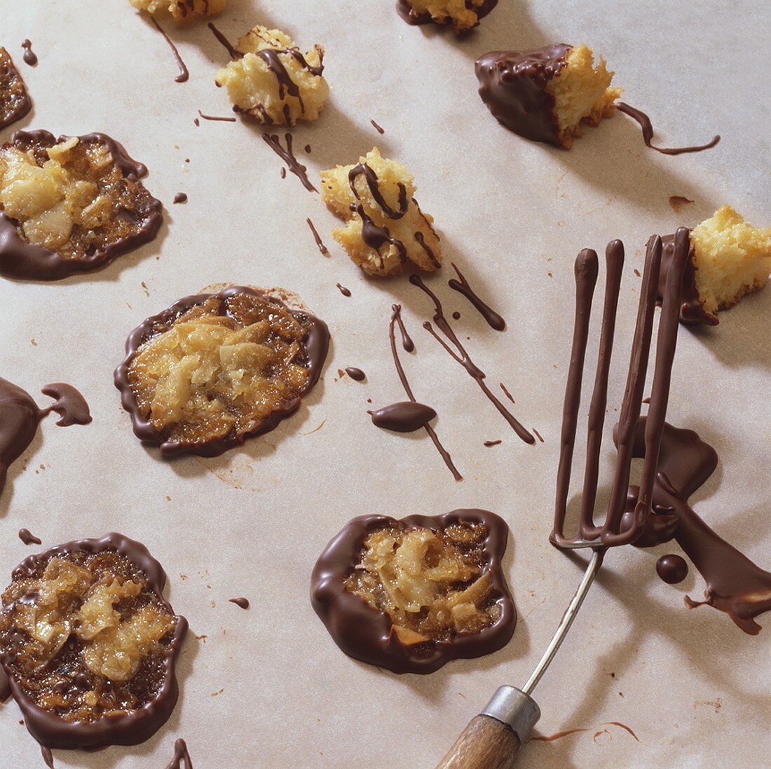 Almond thins & almond & candied peel clusters on baking parchment