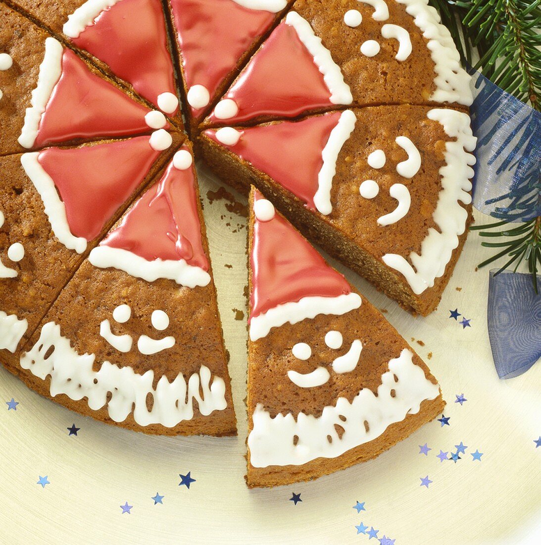 Round gingerbread decorated with Father Christmas faces